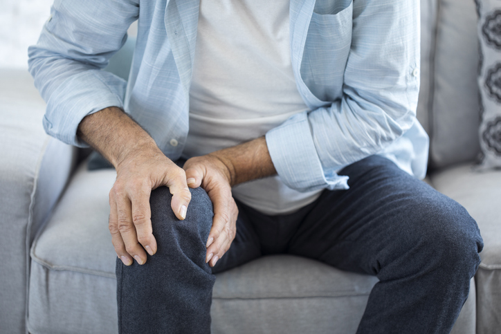 Older man suffering from knee pain